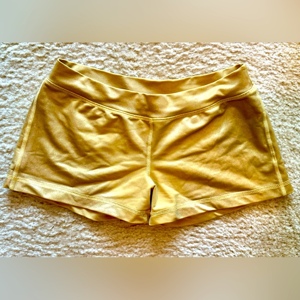 BEBE Sport gold booty shorts